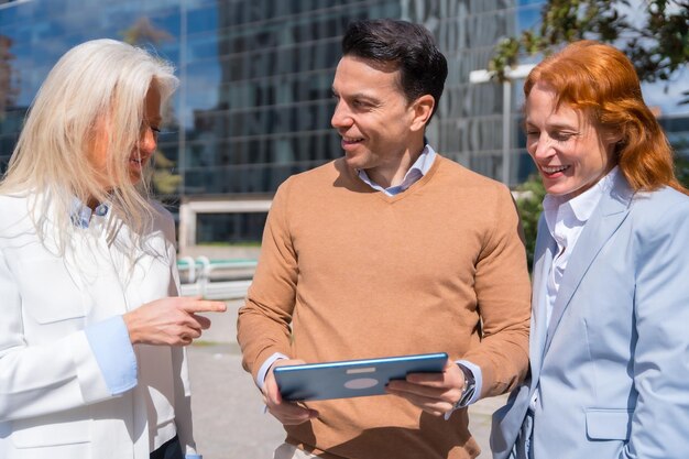 group executives businessmen businesswoman business area looking tablet 242111 28456